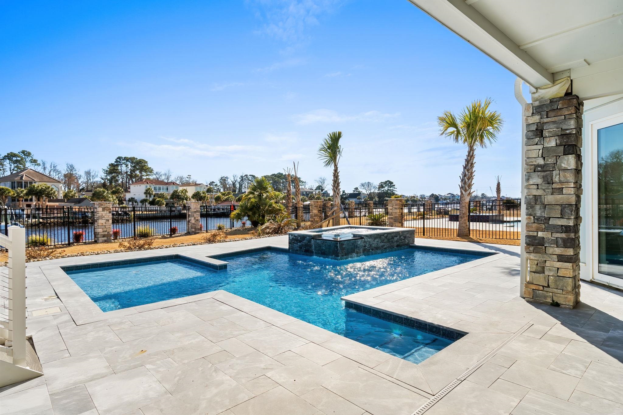 Pool and backyard on the Intracoastal Waterway at Serenity Point, Little River SC